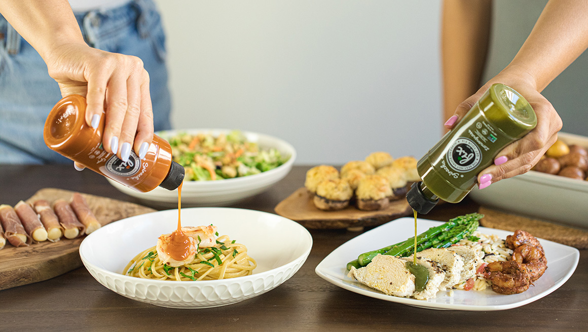 Fix Habanero Ginger and Lemongrass Sriracha sauces being poured on food.